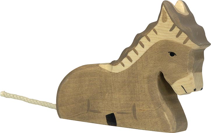 Holztiger Esel liegend